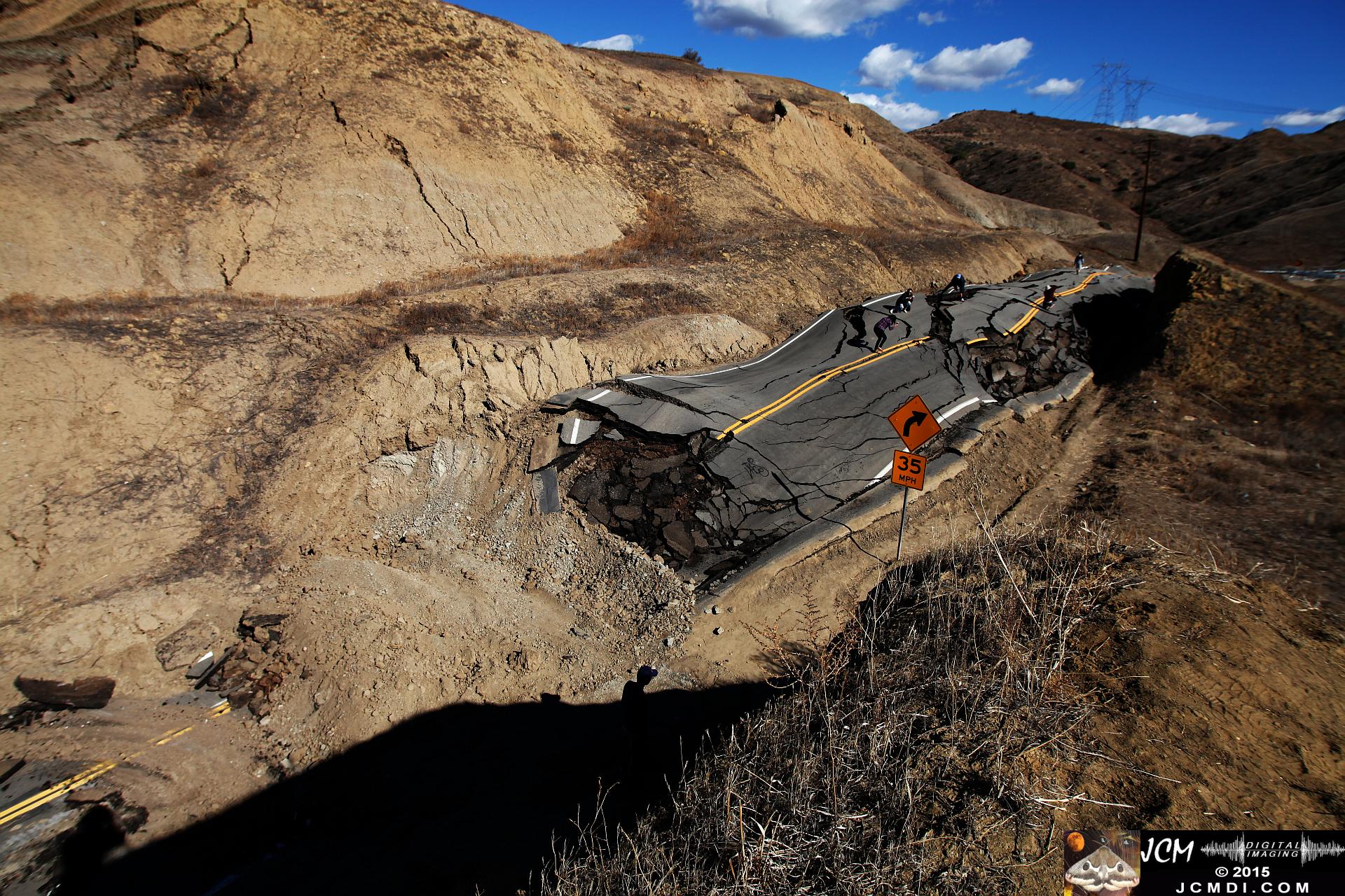 Landslide, buckled pavement, and terrain at Vasquez Canyon Road in Santa Clarita, CA filmed 11-25-2015